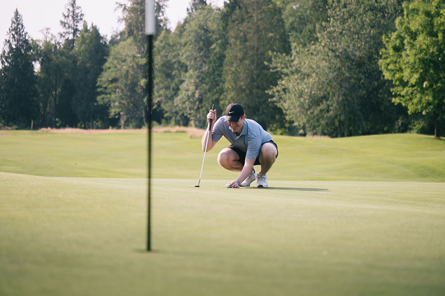 man swinging on green