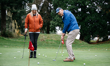 couple playing golf