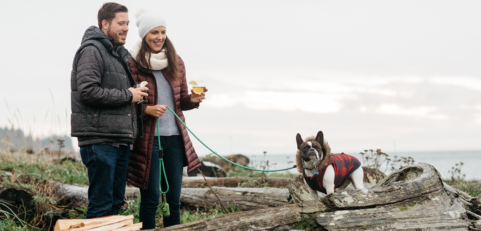 couple with dog on beach