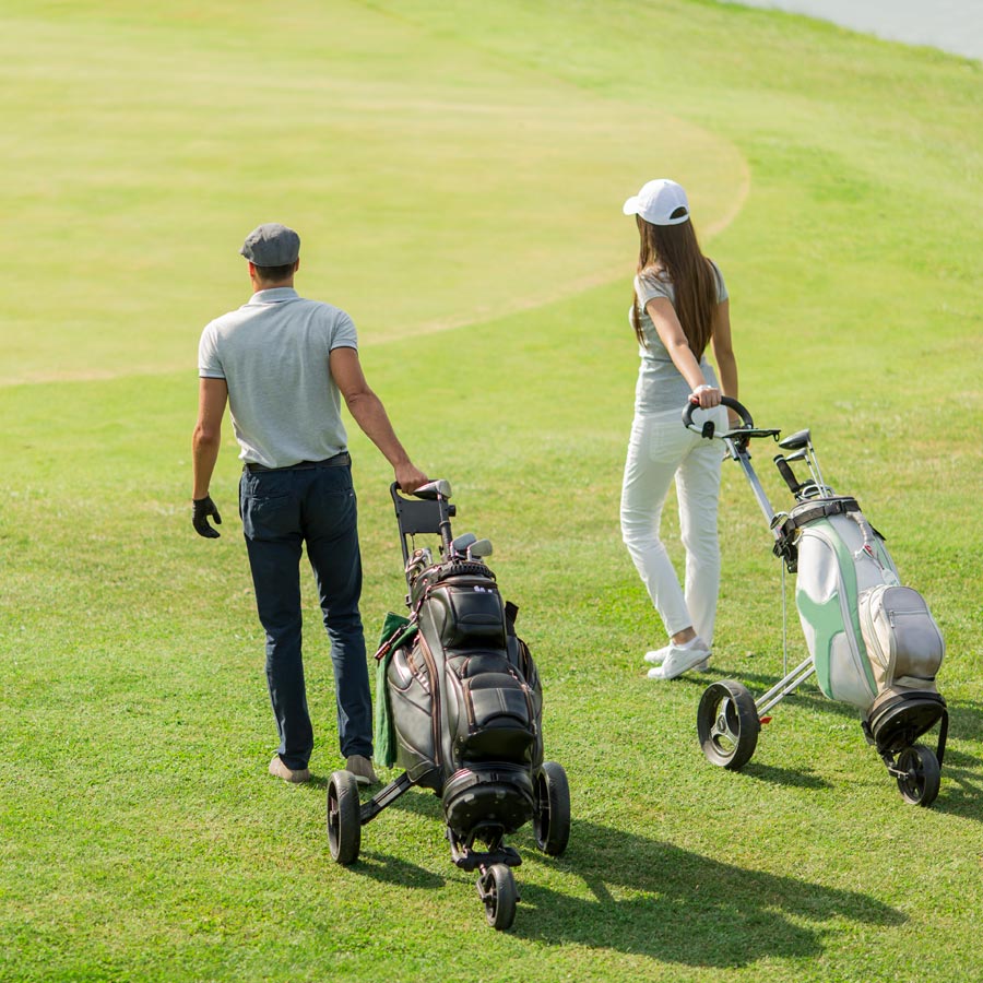 couple with golf bags