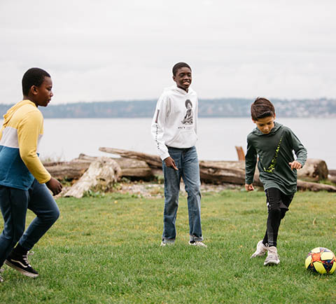 friends playing soccer